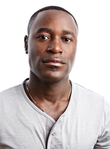 "A handsome young African-American man looks out, serious and even challenging, in this half-length portrait, isolated on white."